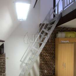 Ship ladder for mezzanine access Ship ladder with guardrails used to access a classroom mezzanine.